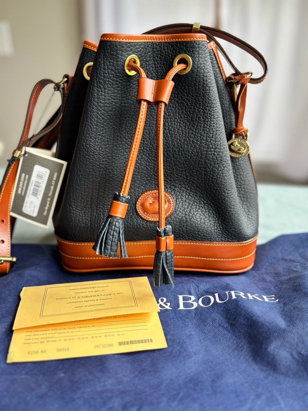 NEW VINTAGE Dooney & Bourke Navy with British Tan Trim Pebbled Leather Bucket